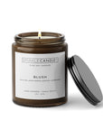 Blush soy candle in amber jar with black lid