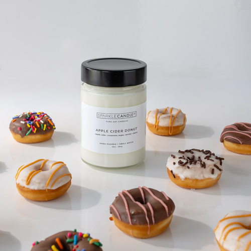 Apple Cider Donut hand-poured soy candle in glass jar, warm autumn scent