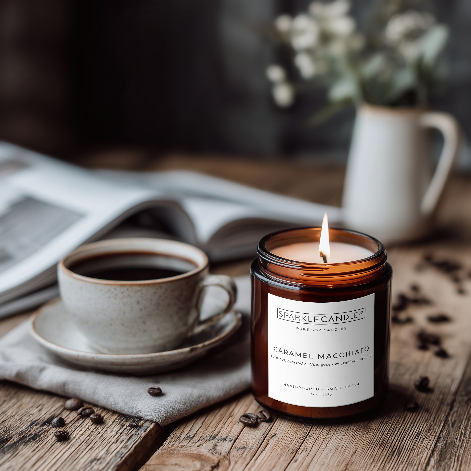 Caramel Macchiato soy candle styled in cozy kitchen setting with roasted coffee beans and coffee cup