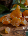 Oranges on a wooden board with text indicating flavor profile.
