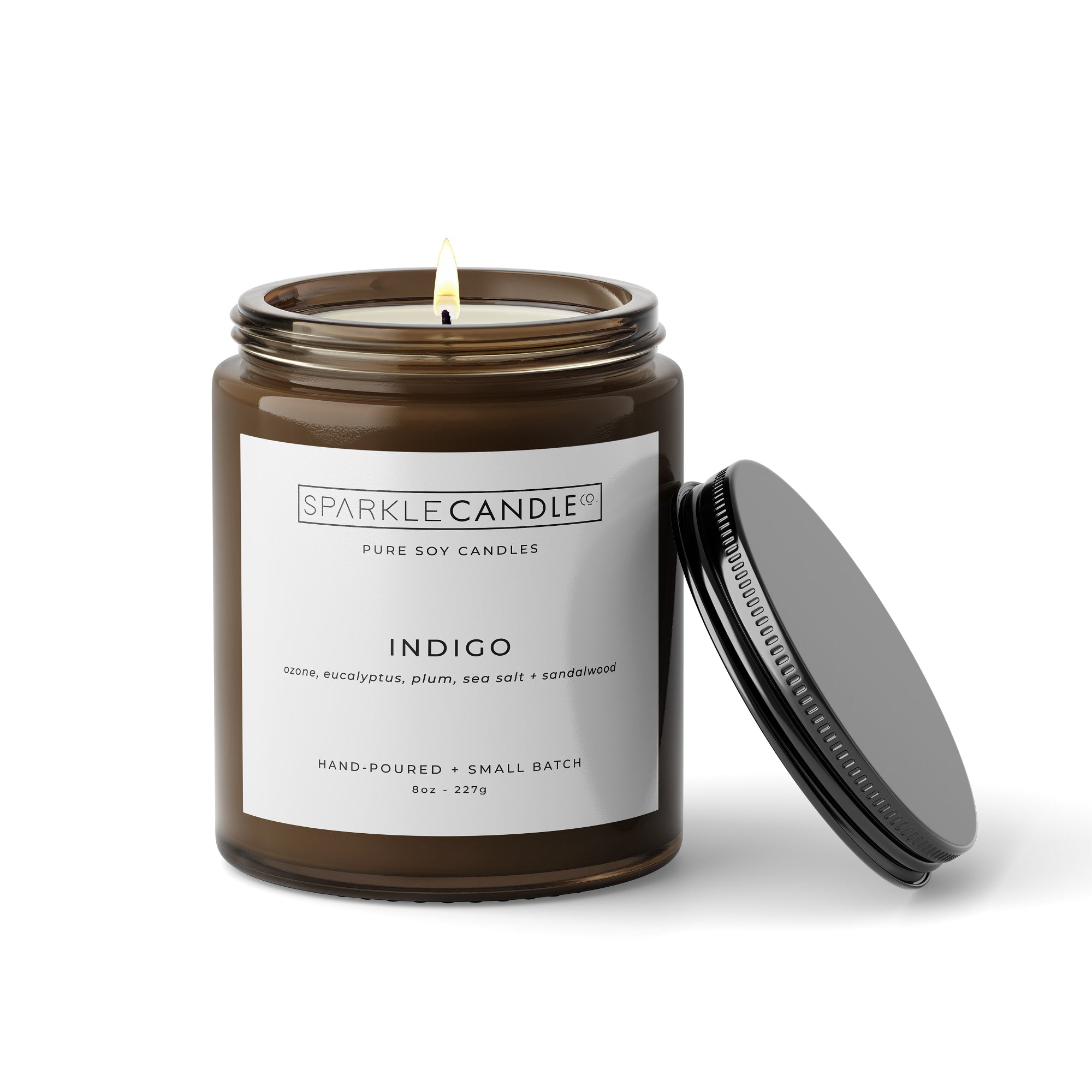 Indigo soy candle in amber jar with black lid
