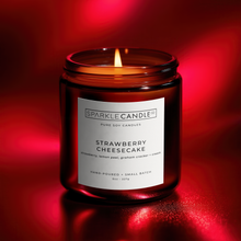 Load image into Gallery viewer, Sparkle Candle Strawberry Cheesecake candle on a red background