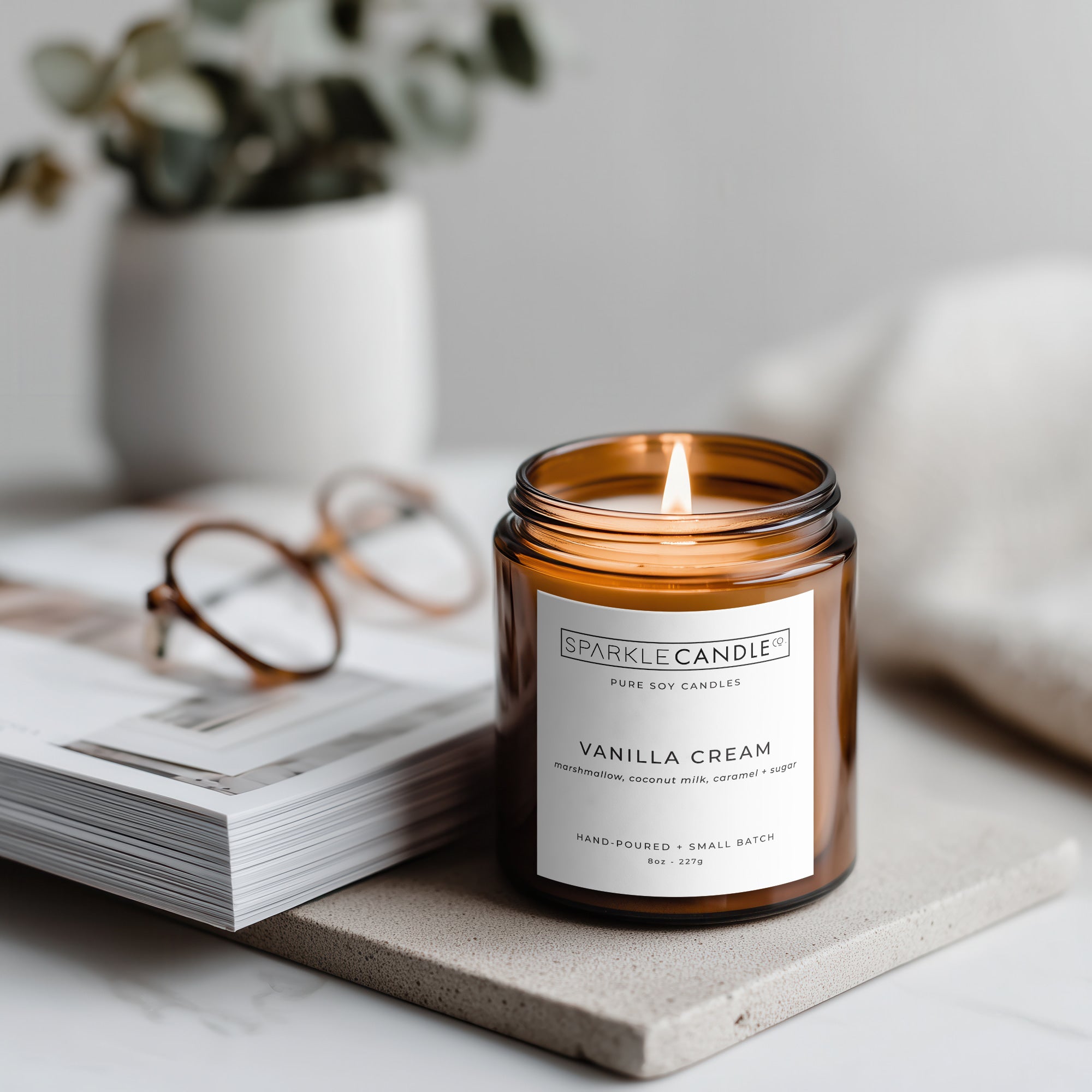 Vanilla Cream soy candle styled in a cozy neutral setting